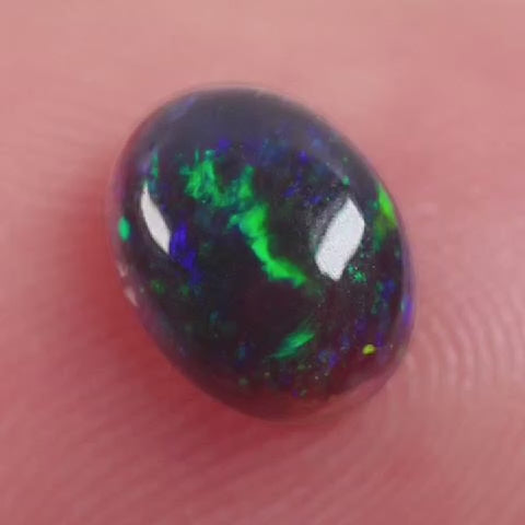 0.6ct Black Opal - 5.2 x 6.6 x 3mm