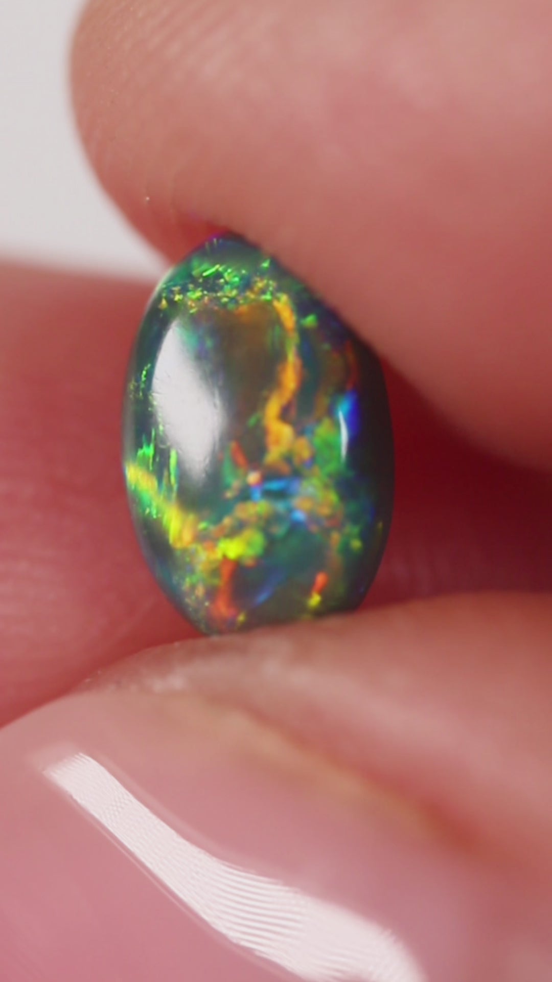0.91ct Black Opal - 5.4 x 8.3 x 3.5mm