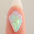 Close detail of moss pattern on dark crystal opal